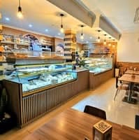 Logótipo de Padaria Pastelaria O Tó — Comércio em Moimenta da Beira