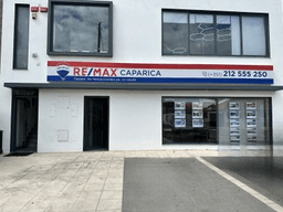Logótipo de RE/MAX Caparica III — Imobiliário em Almada