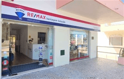 Logótipo de RE/MAX Vantagem Solução — Imobiliário em Almada