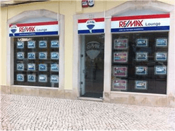Logótipo de RE/MAX Lounge — Imobiliário em Setúbal
